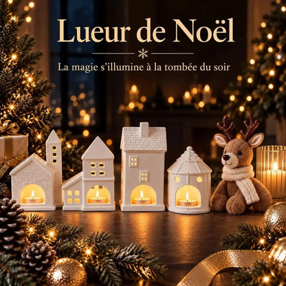 Village de Noël en photophores céramique illuminé à la tombée du soir avec peluche renne et bougies