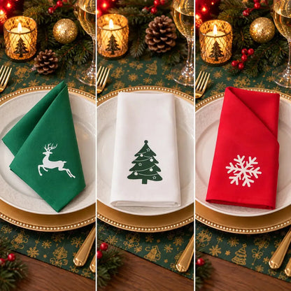 Trio de serviettes de table de Noël en coton, motifs renne vert, sapin blanc et flocon rouge, présentés côte à côte